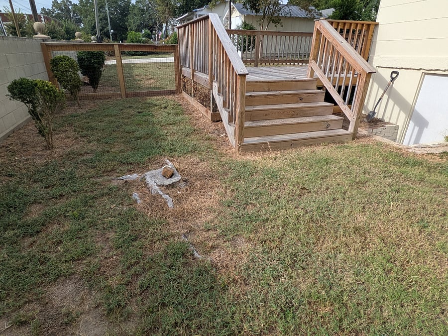 Small dog yard is fully fenced.