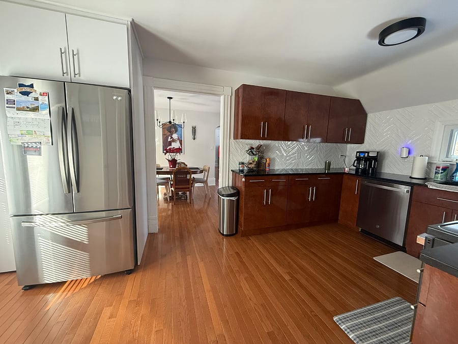 Large kitchen with full-sized stainless steel appliances.