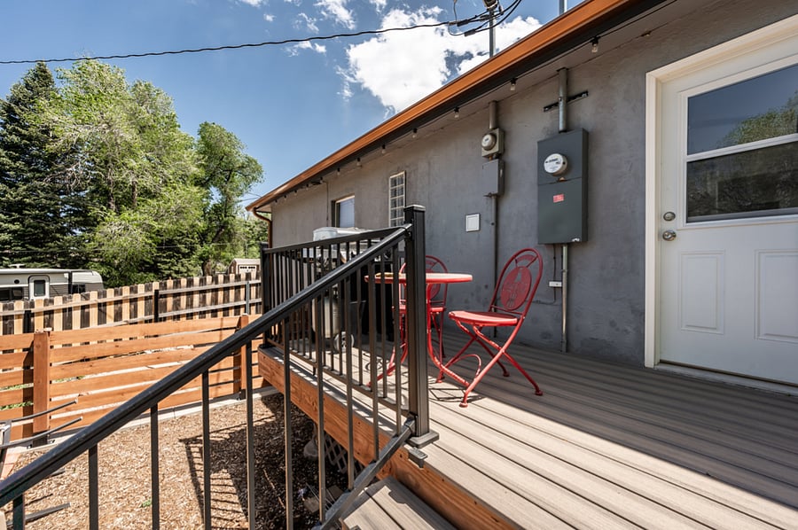 Your private back deck with BBQ grill and gas FP. Door is off of the kitchen.