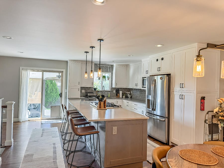 Open concept layout: Large Kitchen Island (seats 4) connected to dining space & coffee bar. 