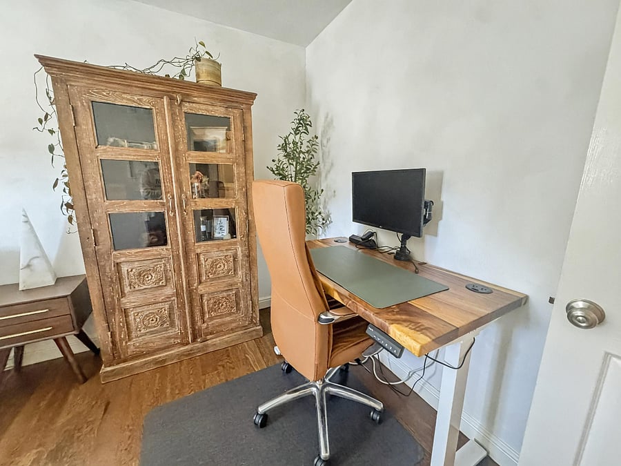 Workspace with ergonomic chair and monitor. (sit to stand desk). L