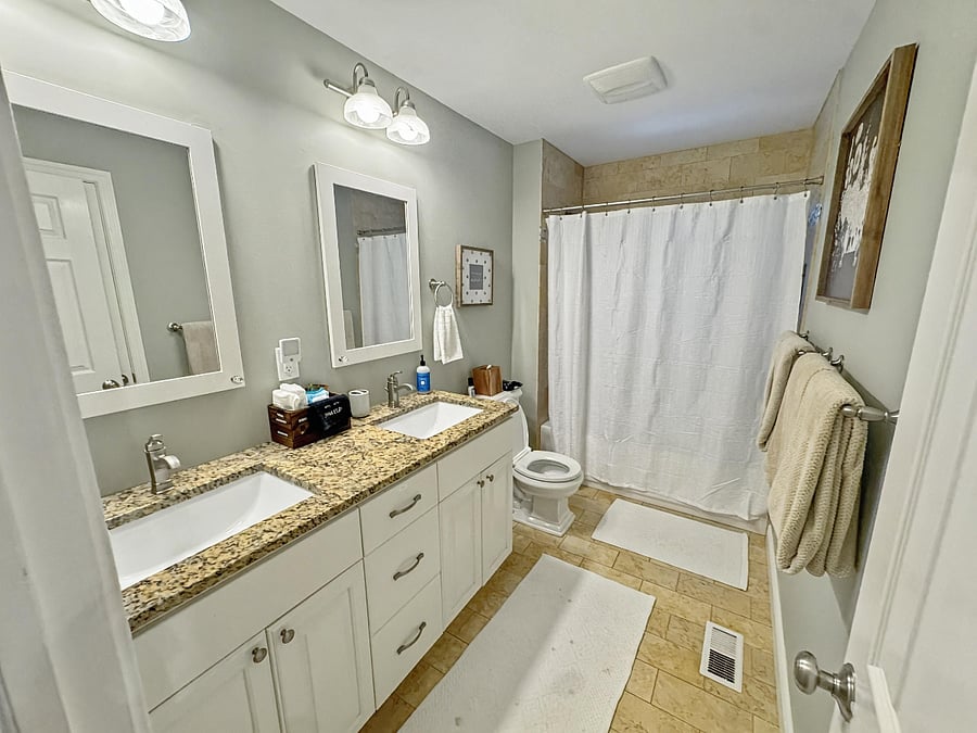 Shared Full bath (Spruce Room + Aspen Grove Room): Shower w/ Bath tub + Dual vanity