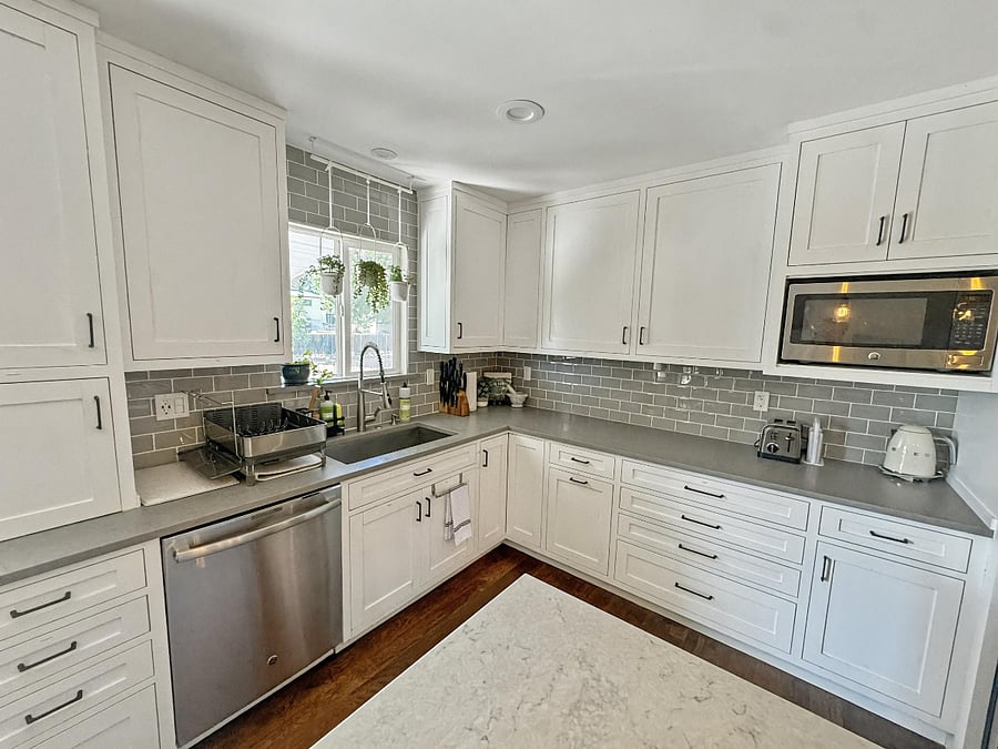 Large kitchen with stainless steel steal GE appliances: Dishwasher + Microwave + Fridge + Oven/5 burner stove. 
