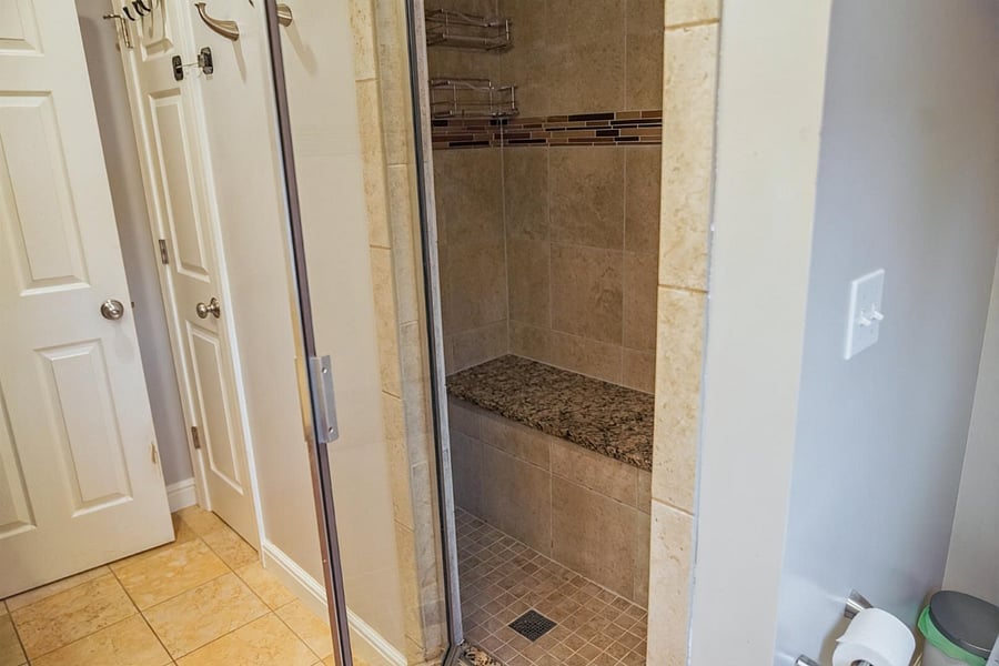 Earth and Ember Room  Ensuite Bathroom: Walk in shower with seat