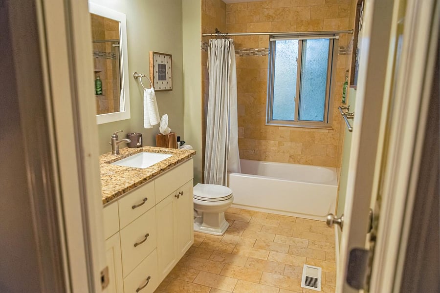 Shared Full bath (Spruce Room + Aspen Grove Room): Shower w/ Bath tub + Dual vanity