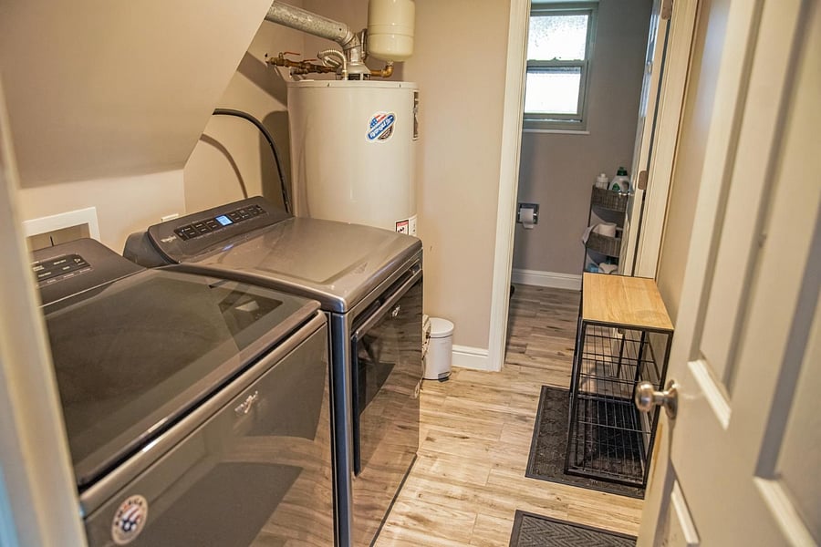 Laundry room connected to downstairs living room + Access to garage. 