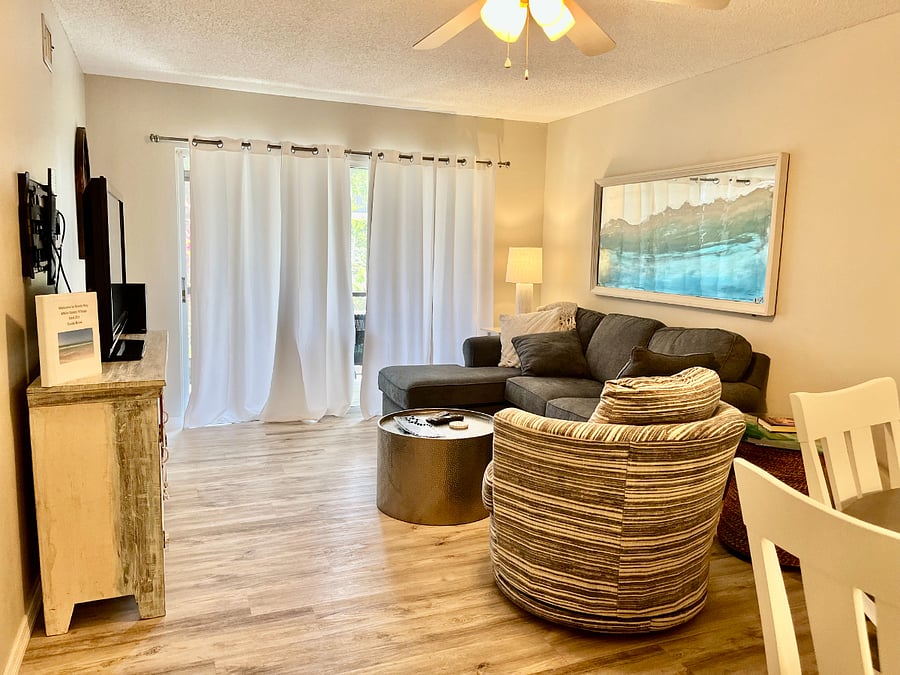 Living room, sliding door leads out to a screened porch.