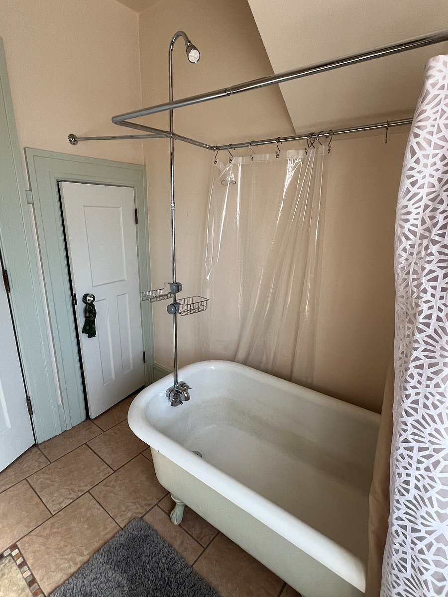 Second full bathroom with clawfoot tub and stand-up shower head installed