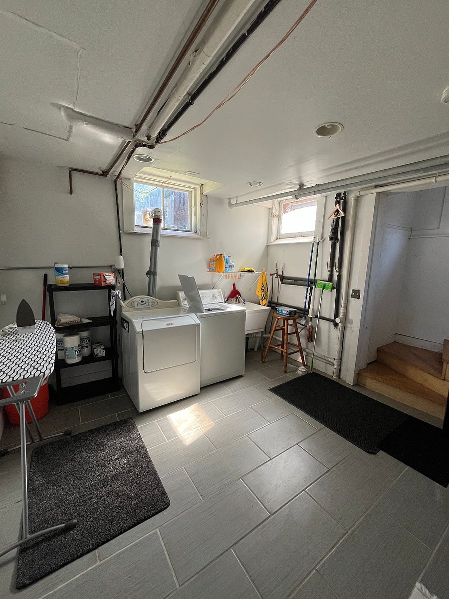 Even the basement gets great light! Washer, dryer, ironing board, laundry chute