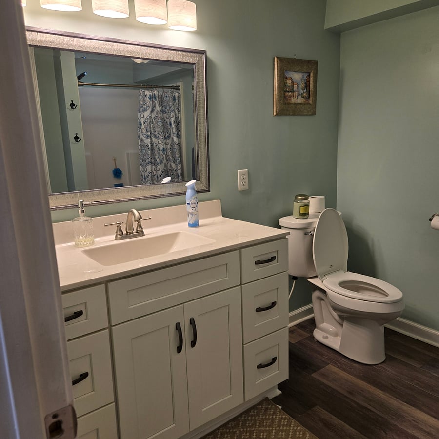 Adjacent to the bedroom, the bathroom is shared with the landlord infrequently when she is working in the apartment.