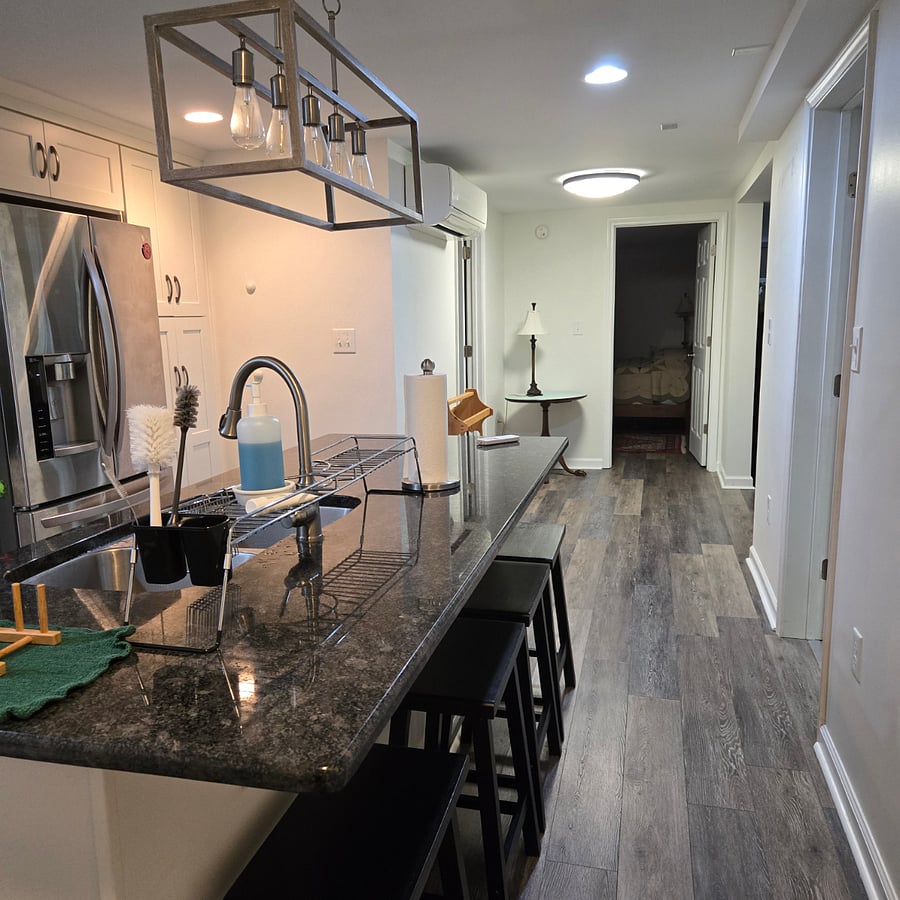 Looking from the kitchen to the rental bedroom, the bathroom is to the left and the art room is to the right. 