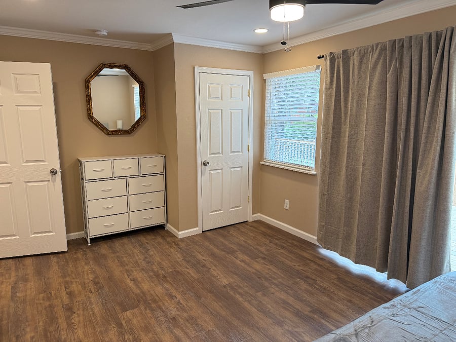 main bedroom with king size bed and bathroom 