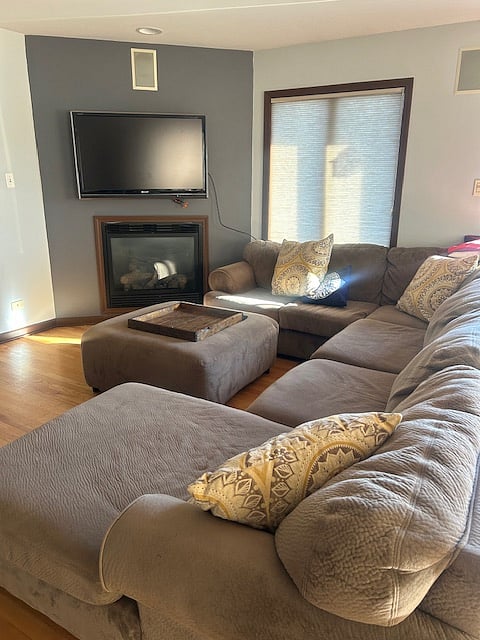 Living space with TV and fireplace.