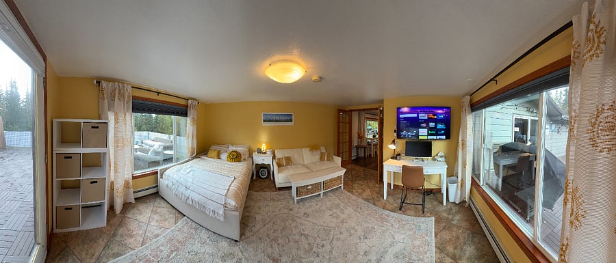 Our sunshine bedroom has a desk area, sleeper sofa, windows all around, and black out shades.