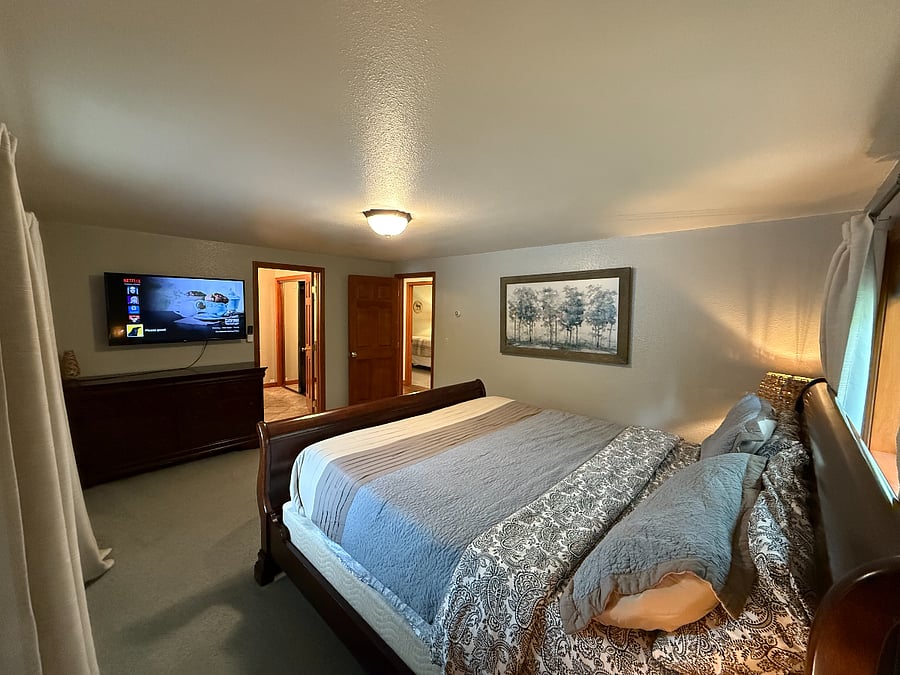 Master bedroom, with king size bed, and attached master bathroom