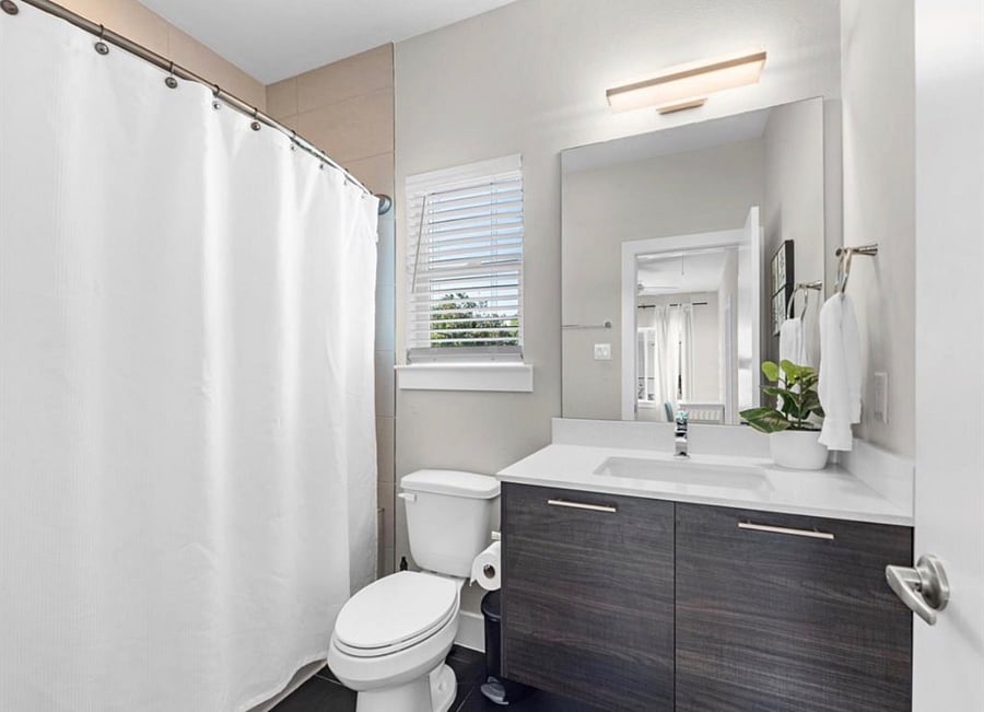 Second bathroom is also spacious. Tub shower combo in this one. 