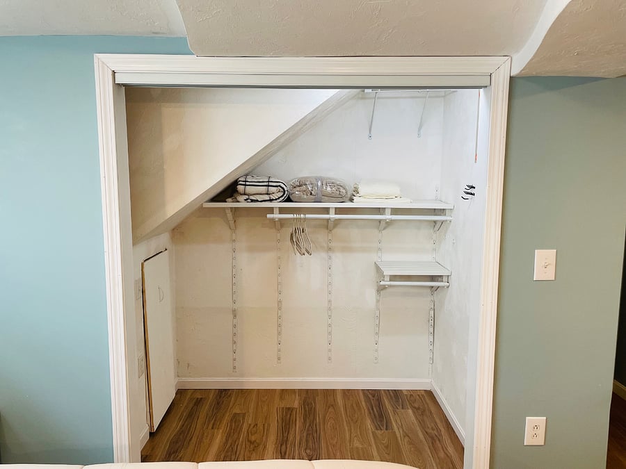 Big closet adjacent of bed for storage 