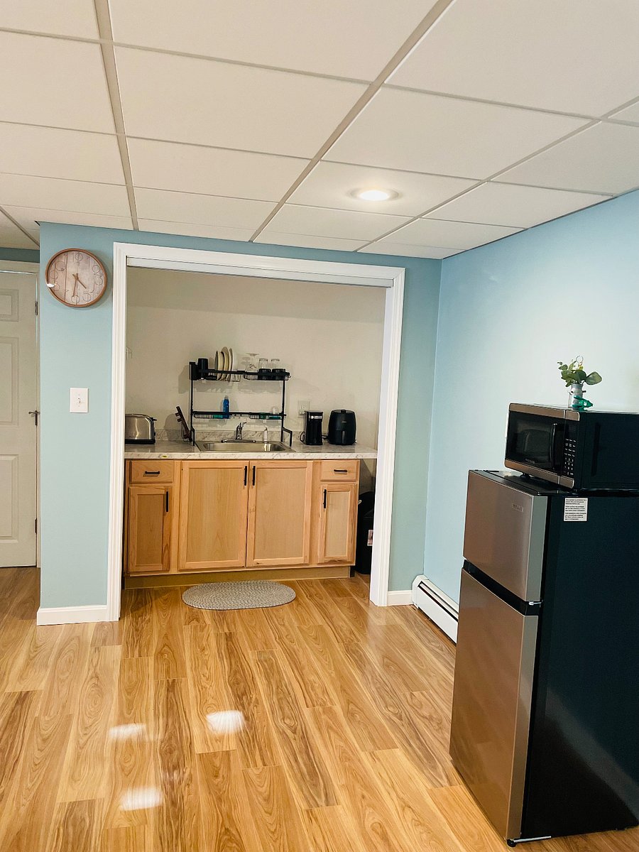 Equipped with coffee maker, air fryer, toaster, microwave, medium size fridge with freezer. 