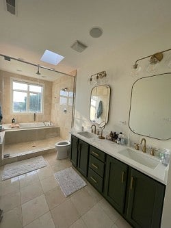 Master ensuite bathroom with soaking tub and rain shower