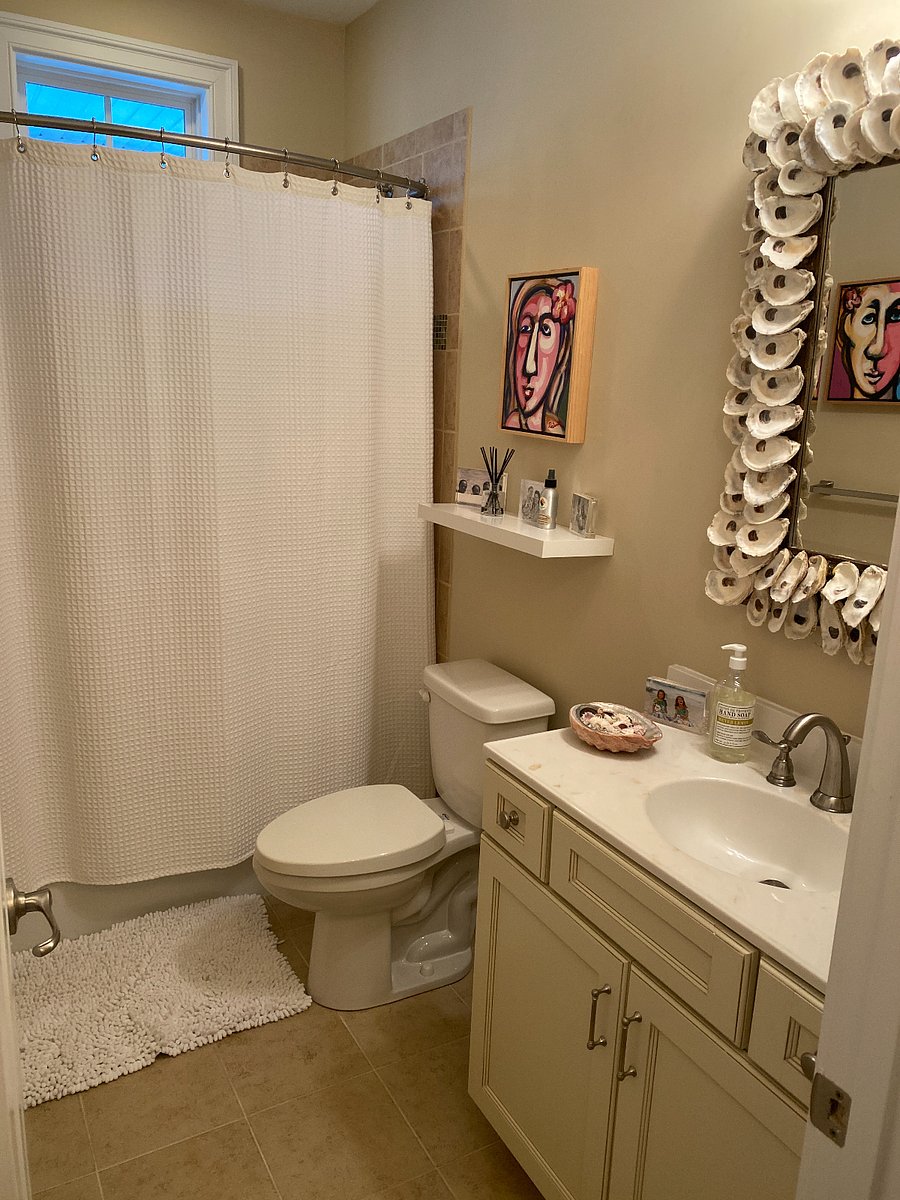 Bathroom connected to bedroom with two Queen beds.