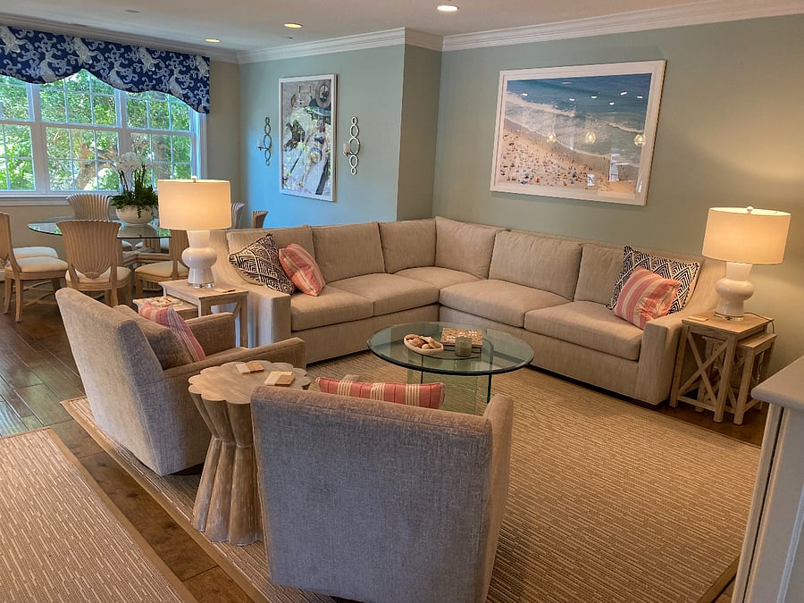Main living area that opens to dining room and kitchen. Dining table seats 8.