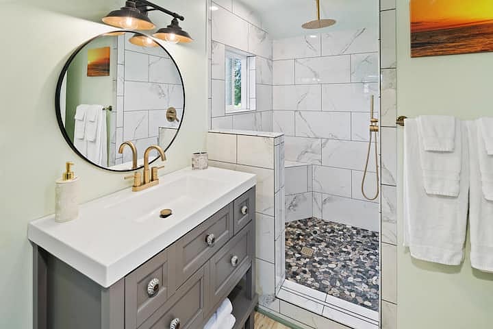 Big inviting shower with seat and rain shower head. Your bathroom should have everything you need from hairdryer to cotton swabs. If not just let us know. 