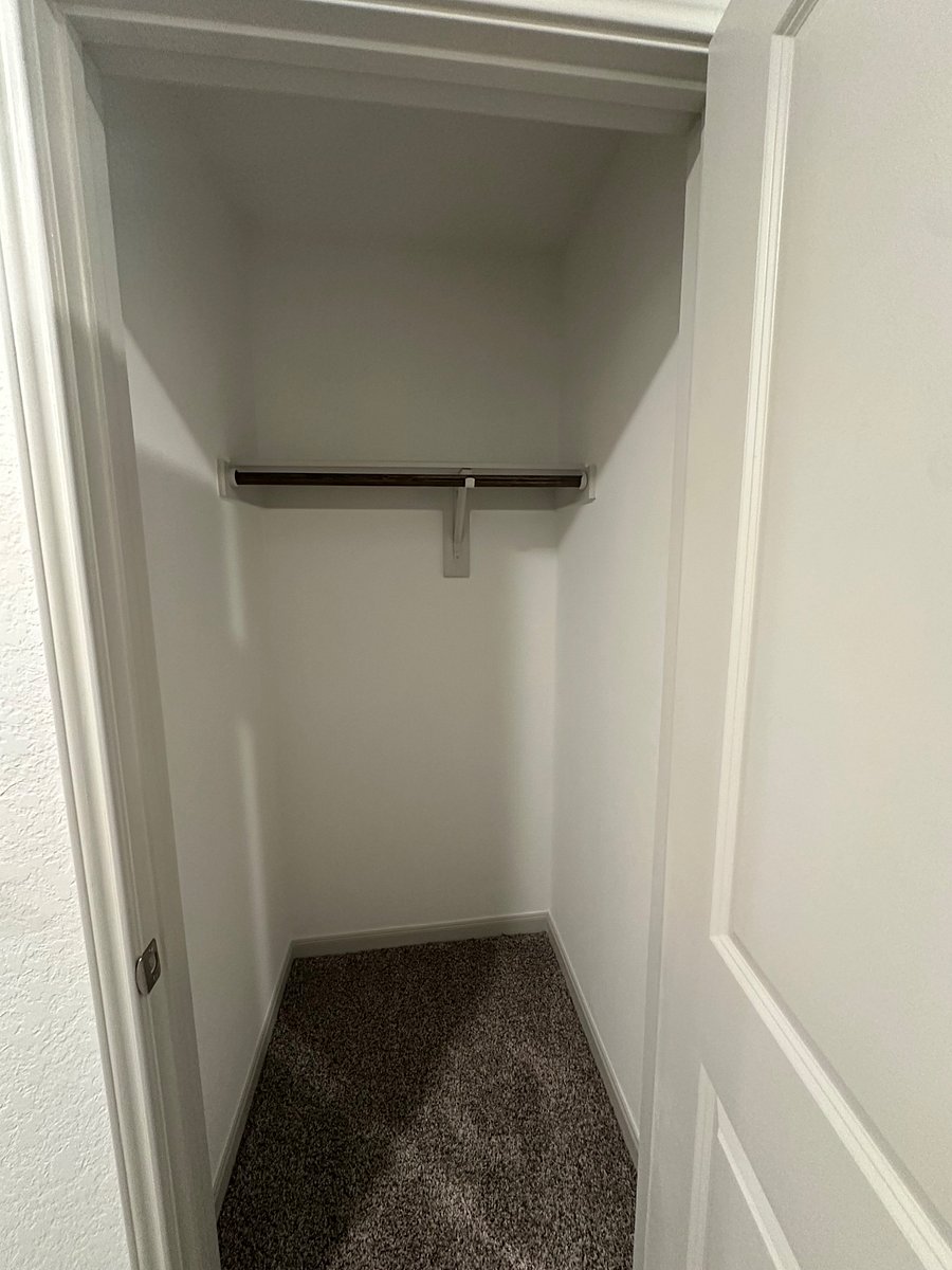 Coat closet next to washer/ dryer room.