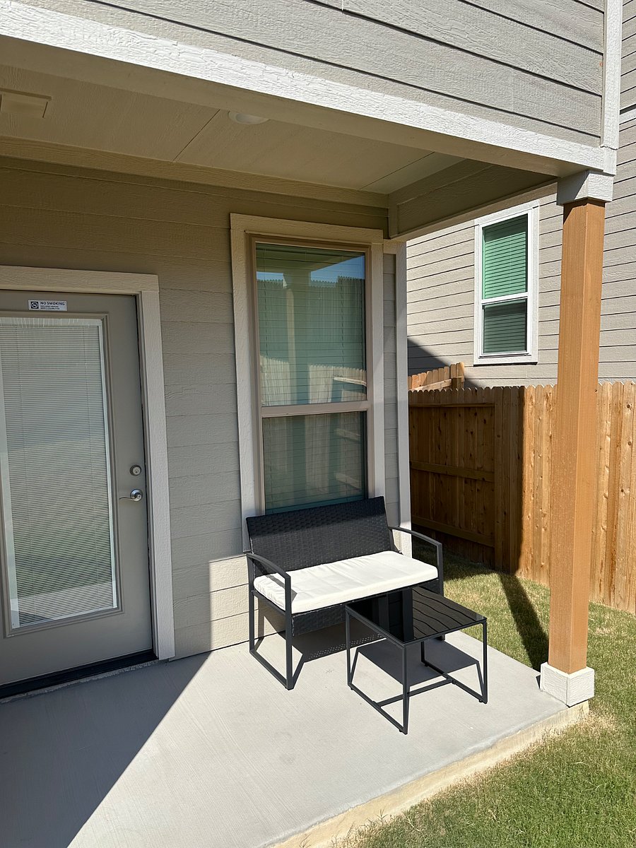 Lounge chair and coffee table on the back patio.
