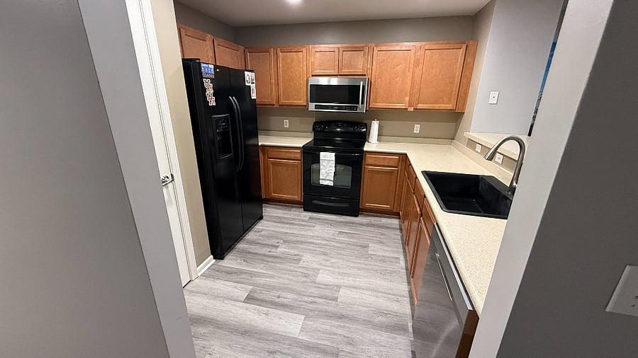 Kitchen with stove, microwave, dishwasher.