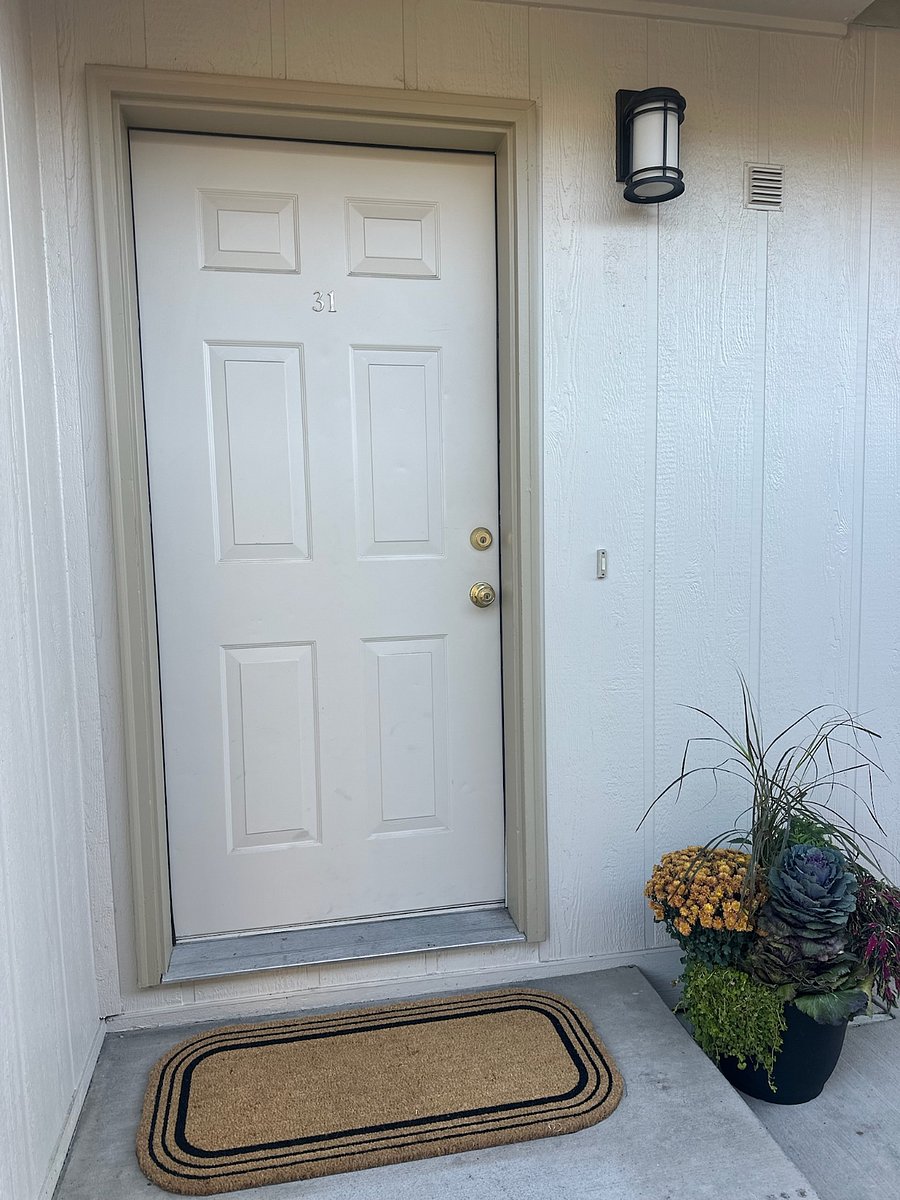 door entrance across from detached garage.  Now has digital entry. NO KEYS!