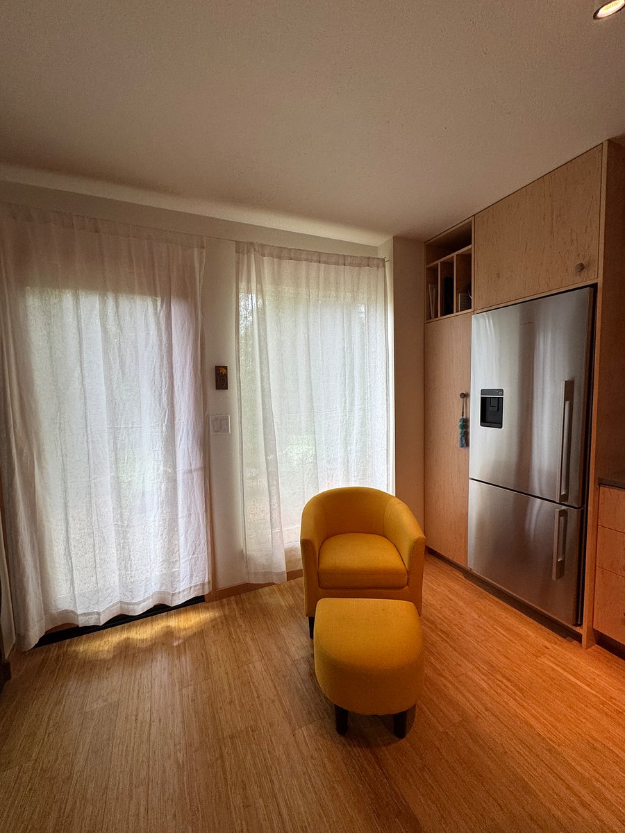 Curtains on front door and windows for night time privacy.