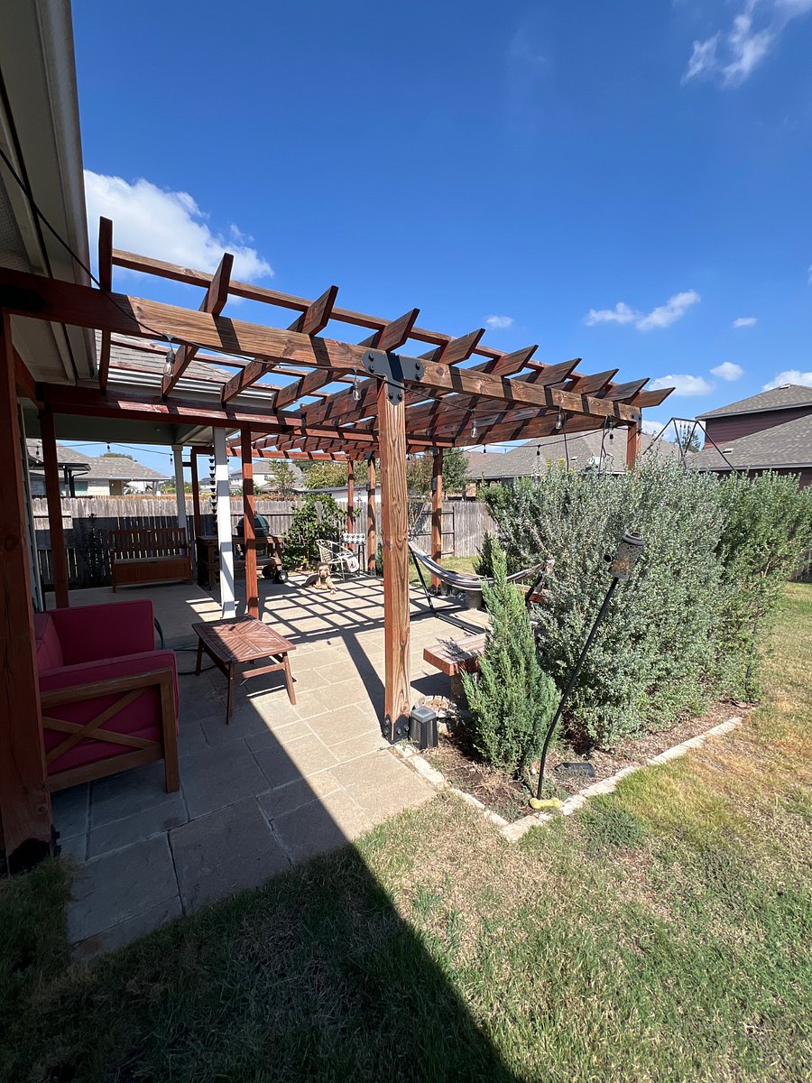 Several Love Seats and bench seating. Outdoor lighting. Privacy hedges.