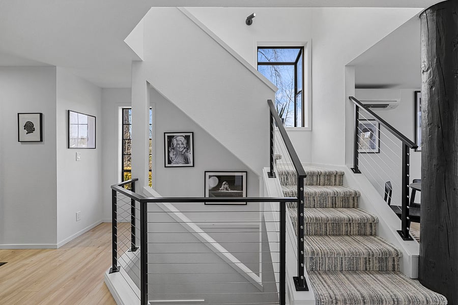 Stairs up and down to bedrooms (2 up, 1 down, each floor has a bathroom).