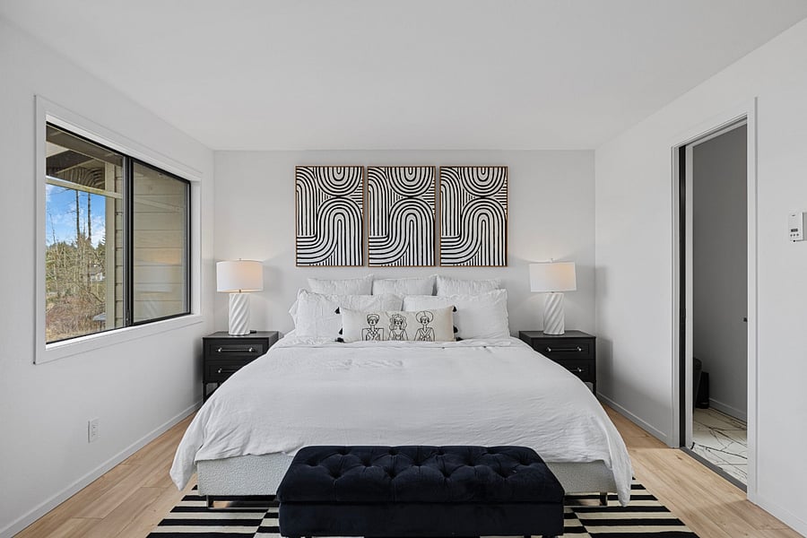 King size bed with water views in upper bedroom