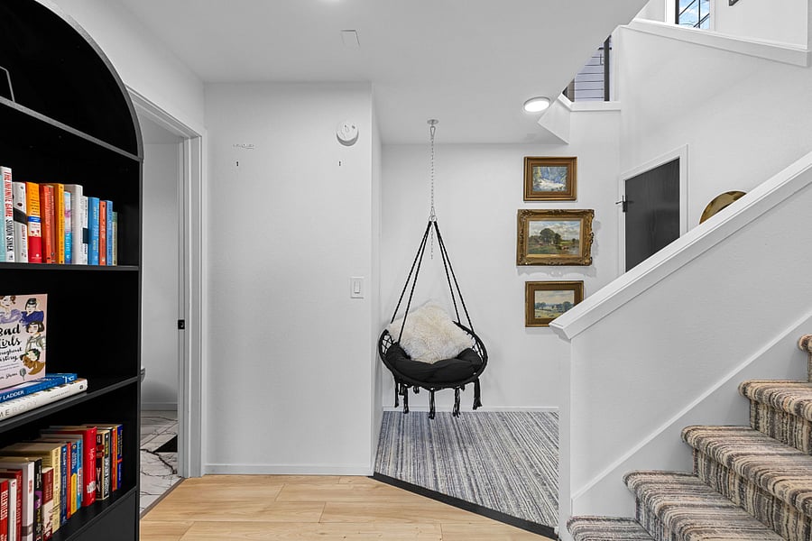 Lower nook with desk area and bathroom with shower to the left.