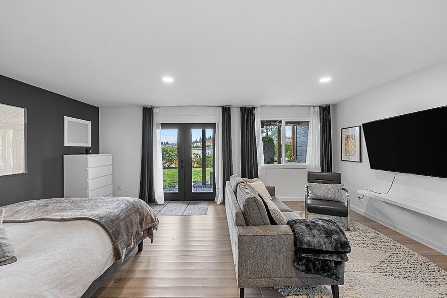 Lower suite has queen bed, patio and sofa/TV watching area as well as its own private bath.
