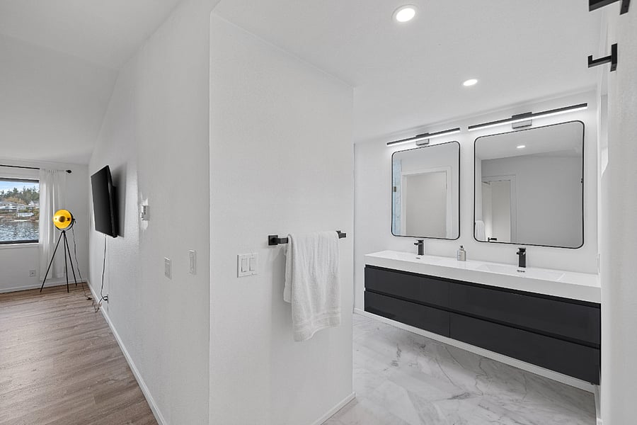 Spa inspired bathroom with travertine marble floors and shower.