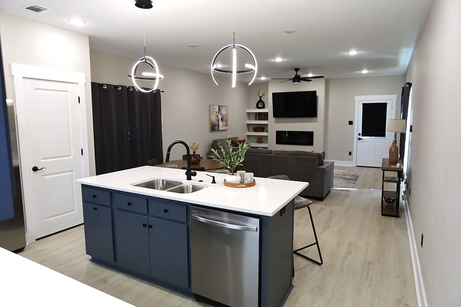 Open-Concept Kitchen & Living Area 

Enjoy a bright, modern space designed for both comfort and connection. The seamless flow between the kitchen and living room makes it easy to cook, relax, or unwind after a long day.