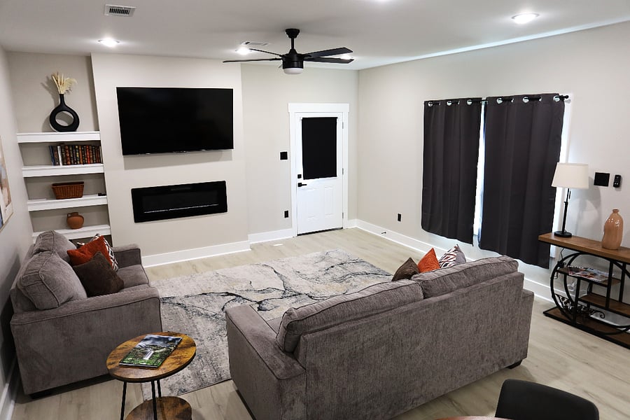Cozy Fireplace & Curated Bookshelf 

Unwind in the heart of the home with a warm fireplace and a thoughtfully styled bookshelfadding a touch of boho charm and modern comfort to your stay.
