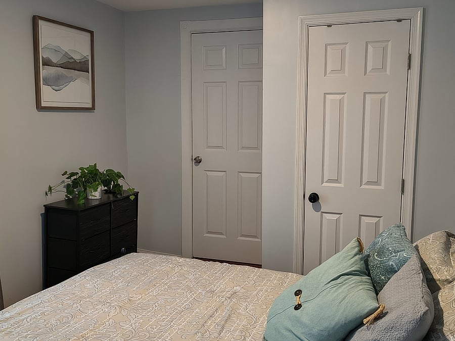 Second bedroom-closet and door to shared full bathroom.