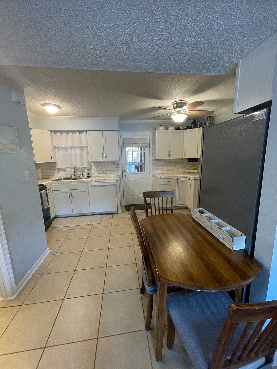 Full kitchen with convection oven, dishwasher, microwave, large refrigerator, and coffee bar.