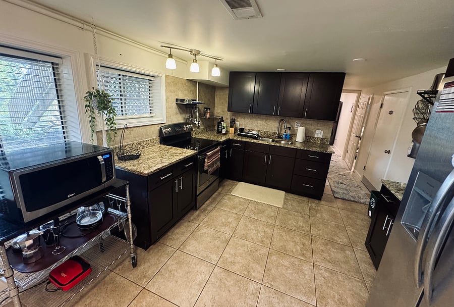 Ample kitchen space for three guests, a full refrigerator, full-sized stove and microwave.