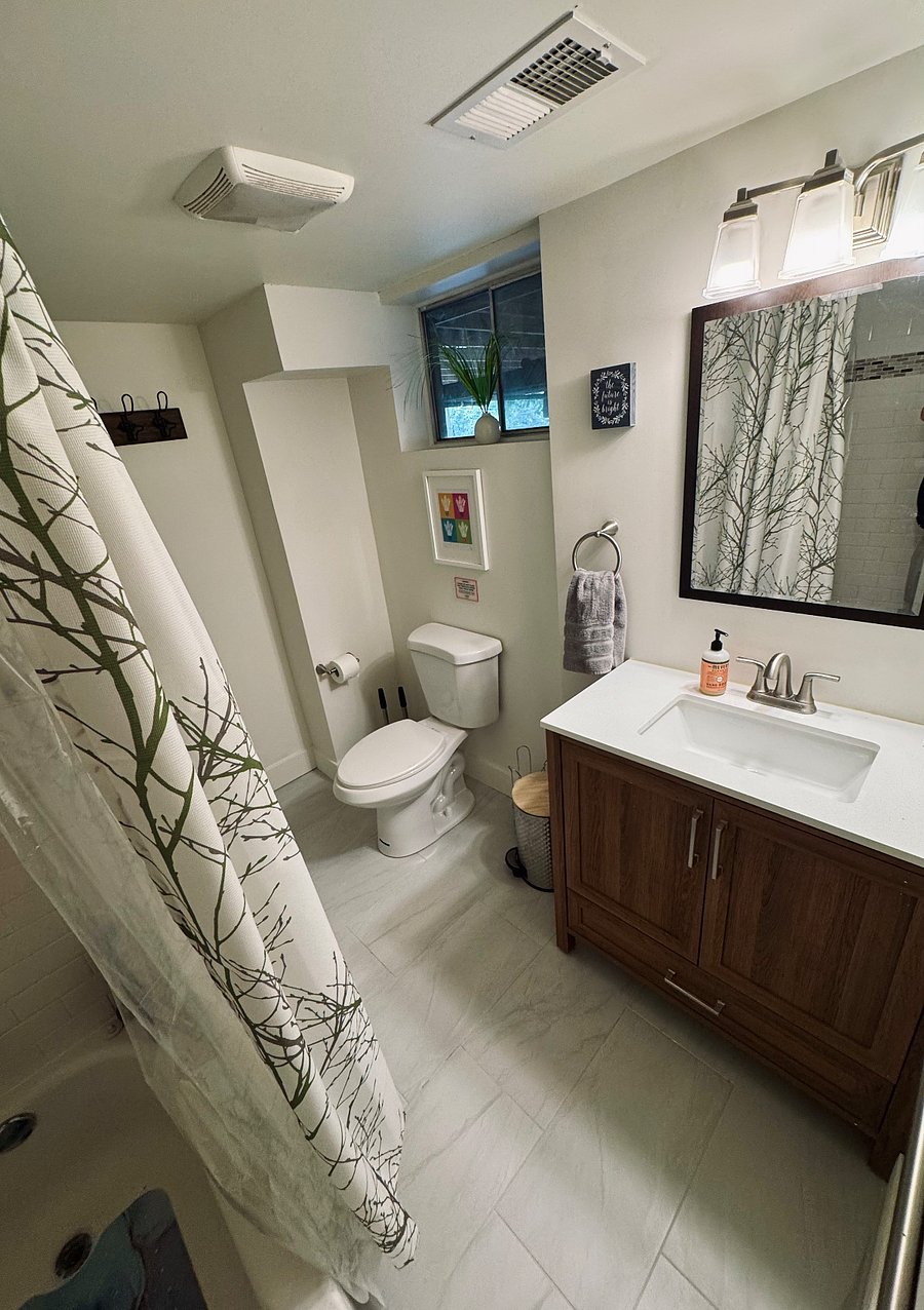 Full bathroom with shower/tub combination.