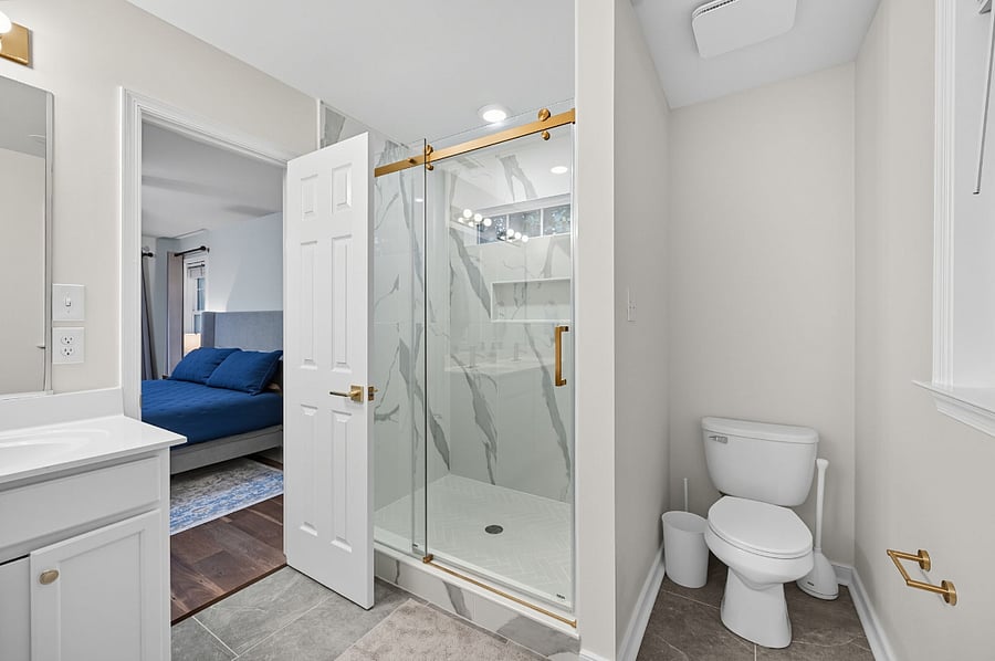 Updated ensuite with dual sinks, large walk-in shower, and modern finishes. Designed for daily convenience.