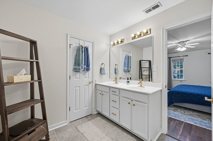 Updated ensuite with dual sinks, large walk-in shower, and modern finishes. Designed for daily convenience.