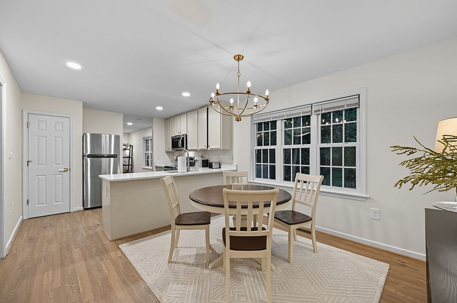 Functional dining area with seating for four and ample natural light.