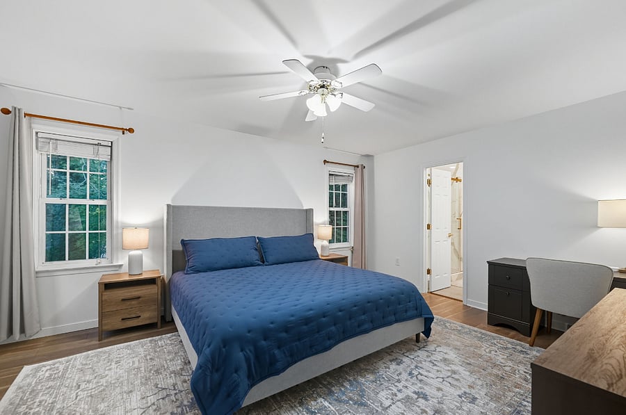 Bedroom with king bed, flat-screen TV, and desk. Great for traveling professionals or couples.