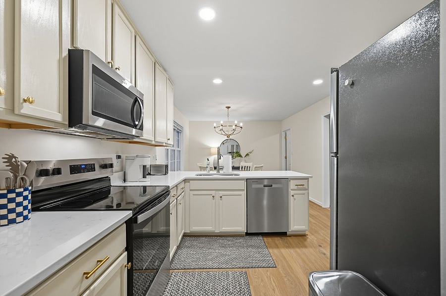 Updated kitchen with stainless appliances, quartz counters, microwave, blender, and all cooking essentials. Move-in ready for extended stays.
