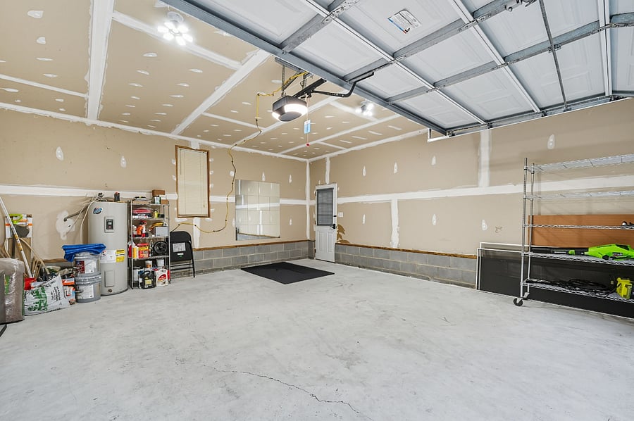 Two-car garage with storage and a small fitness bench. Extra space for equipment or personal items during your assignment.