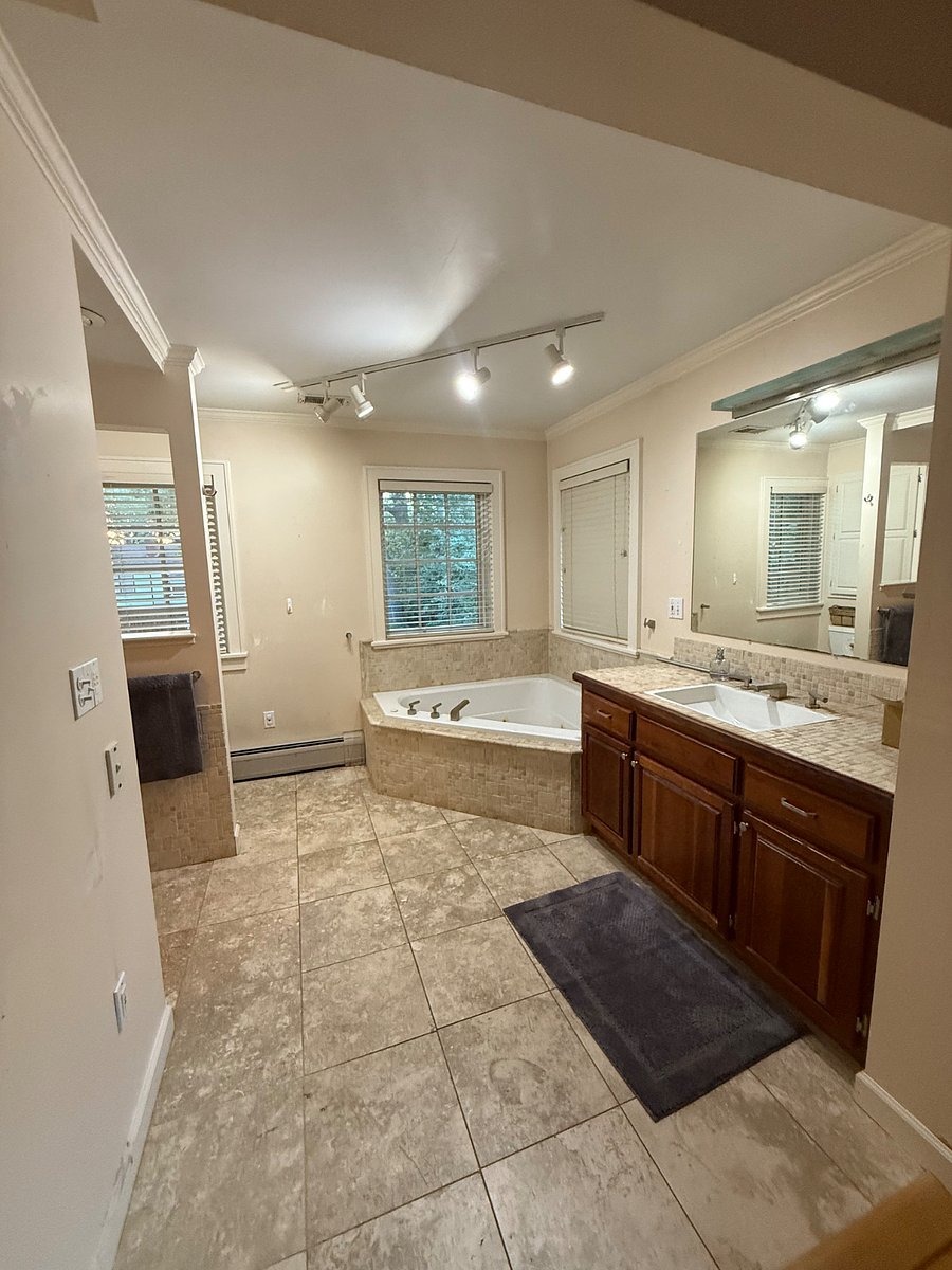 Master Bathroom. Working Bath tub and shower around the corded.